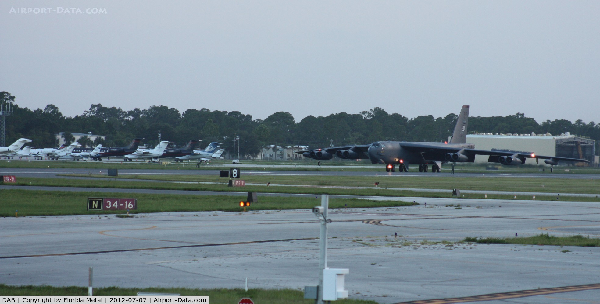 Daytona Beach International Airport (DAB) - B-52 just landed on Rwy 7L, a couple crew members guiding it to back taxi