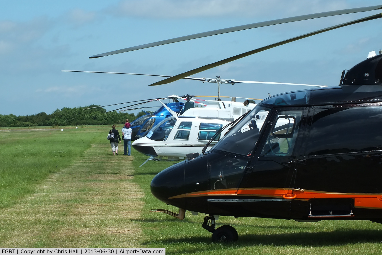 Turweston Aerodrome Airport, Turweston, England United Kingdom (EGBT) - line up of helicopters being used for ferrying race fans to the British F1 Grand Prix at Silverstone