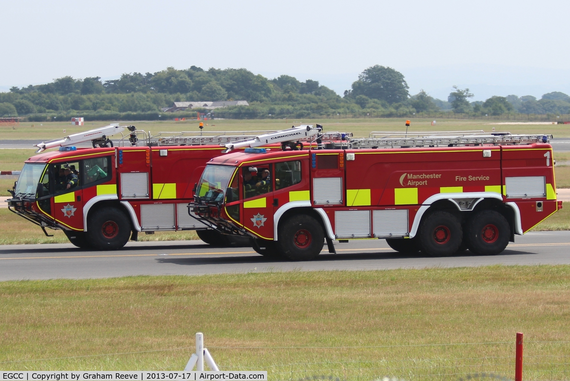 Manchester Airport, Manchester, England United Kingdom (EGCC) - Two of Manchester Airport's fire engines. 