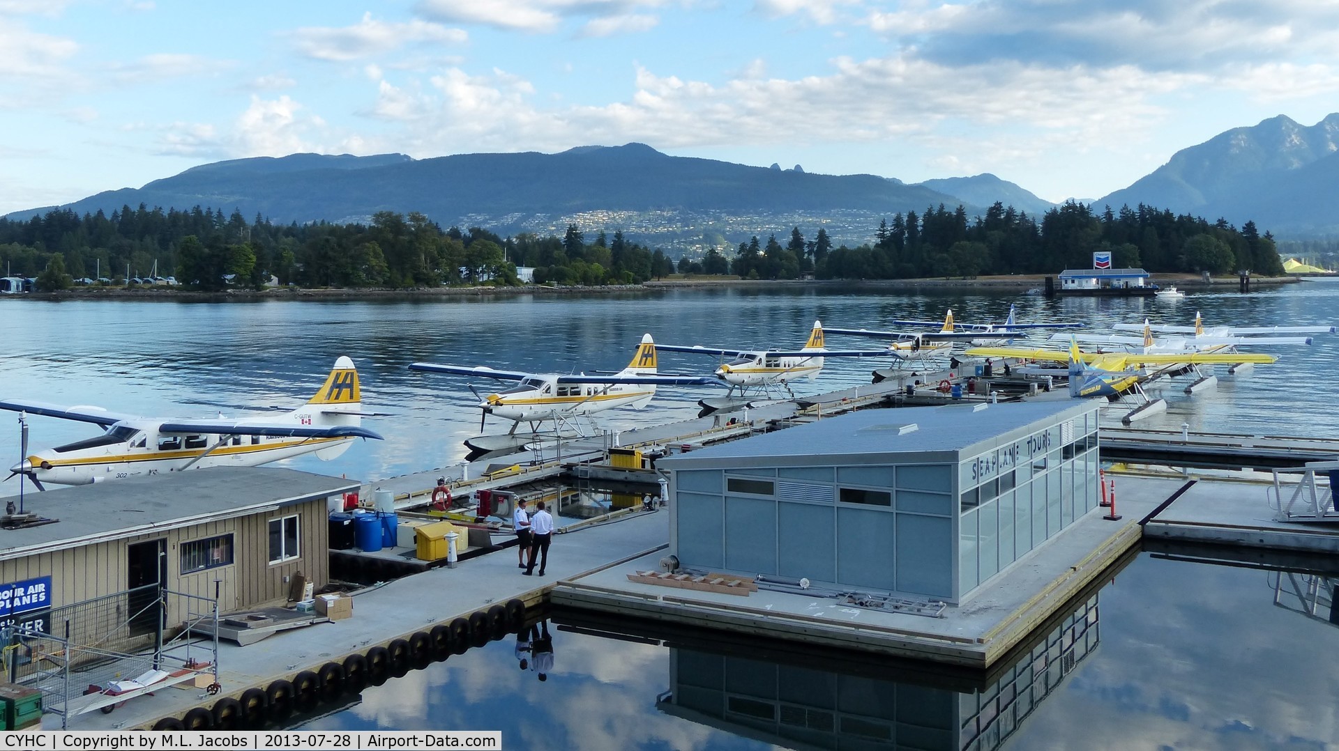 Vancouver Harbour Water Airport (Vancouver Coal Harbour Seaplane Base), Vancouver, British Columbia Canada (CYHC) - Early overcast Sunday morning at Harbour Air terminal in Coal Harbour.  Stanley Park and the North Shore mountains are in the background.