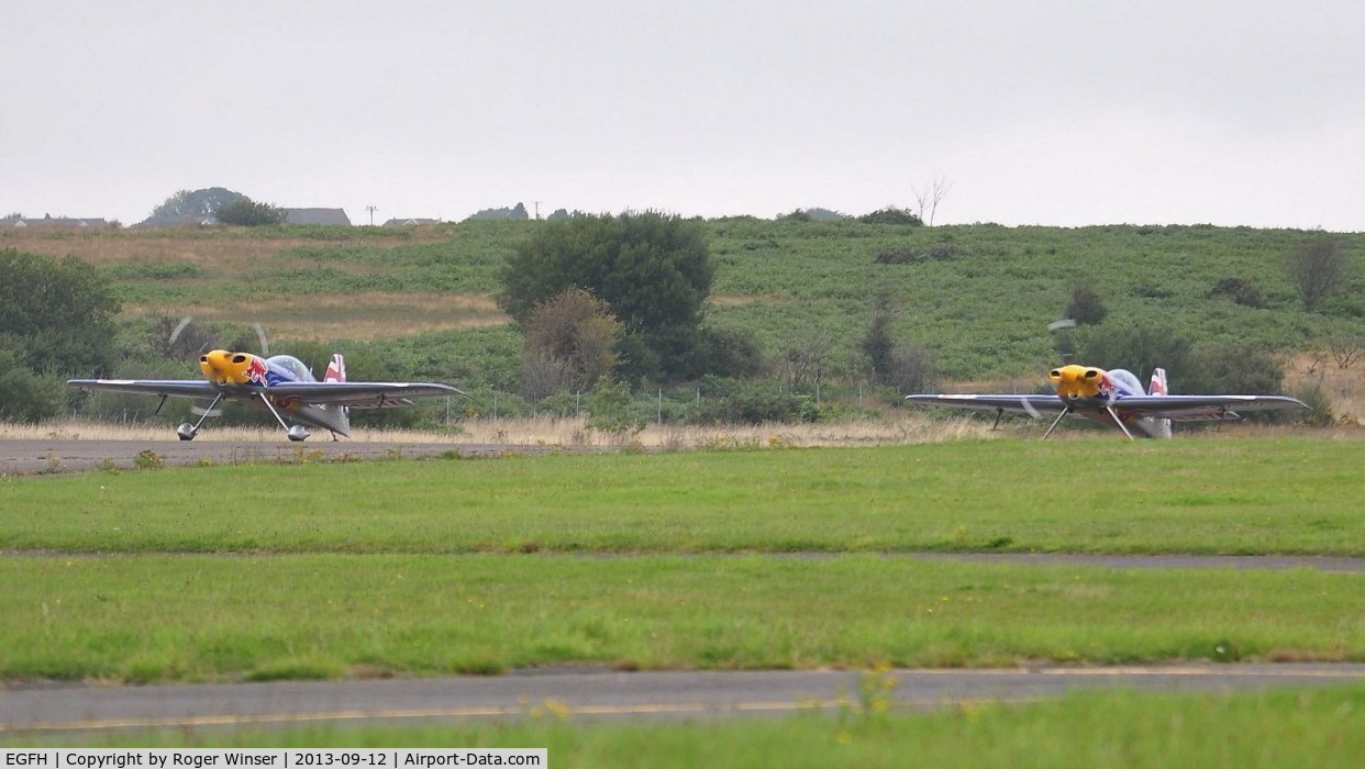 Swansea Airport, Swansea, Wales United Kingdom (EGFH) - Visiting ExtremeAir XA-41's of the Red Bull Matadors about to depart Runway 22.
