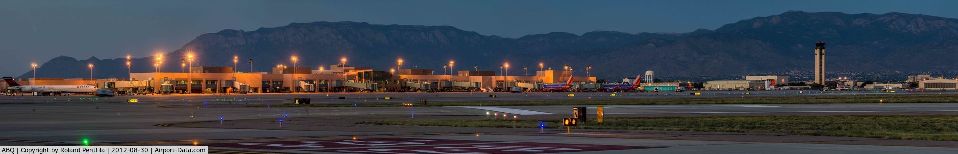 Albuquerque International Sunport Airport (ABQ) - Airport Terminal and tower as seen from field.