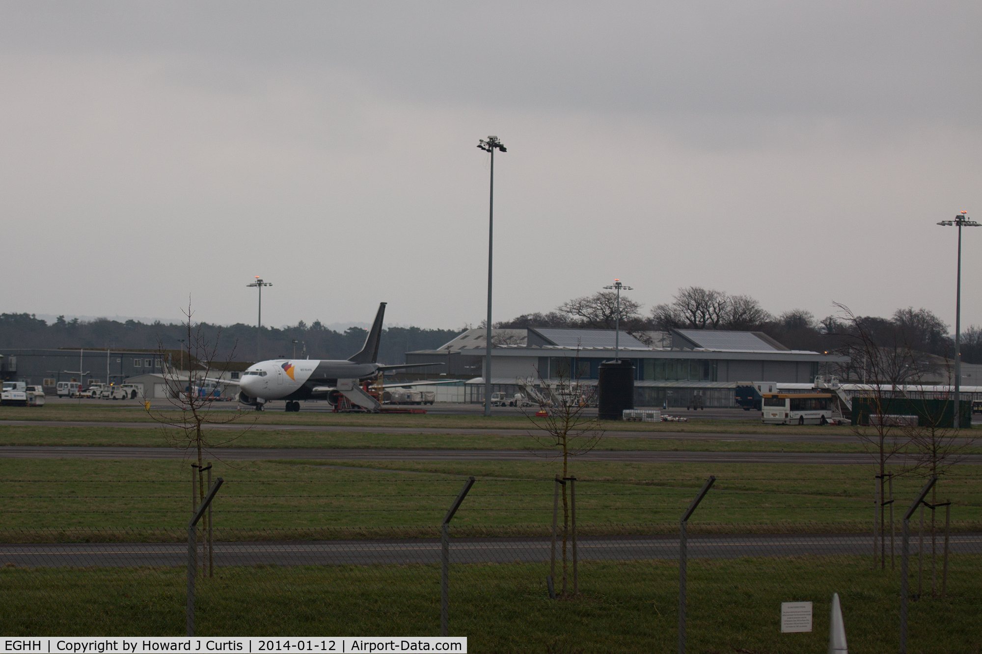 Bournemouth Airport, Bournemouth, England United Kingdom (EGHH) - A dark January afternoon. The Northern apron with 737 G-JMCT parked up.