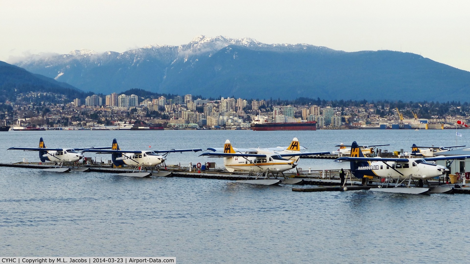 Vancouver Harbour Water Airport (Vancouver Coal Harbour Seaplane Base), Vancouver, British Columbia Canada (CYHC) - Harbour Air terminal in Coal Harbour in the early spring evening.  City of North Vancouver across Vancouver Harbour in the background.