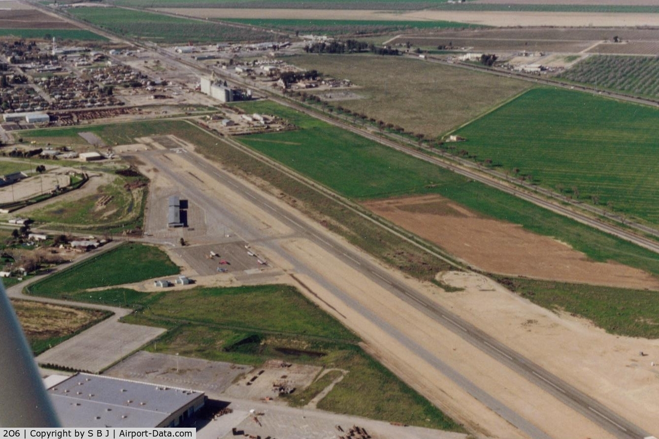 Chowchilla Airport (2O6) - As it looked in 1994. View is north.Most activity is Ag operations. Highway 99 is seen on the far right.