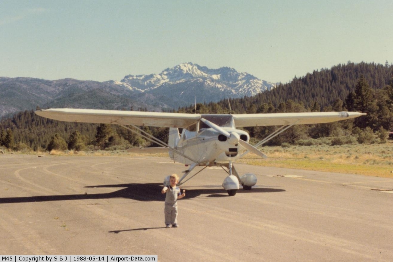 Alpine County Airport (M45) - N6905D at Alpine Co with its veteran pilot pointing toward the runway(unknown why) as he eats lunch.View is almost due south.Trail to the Walker river is on the right of 05D.