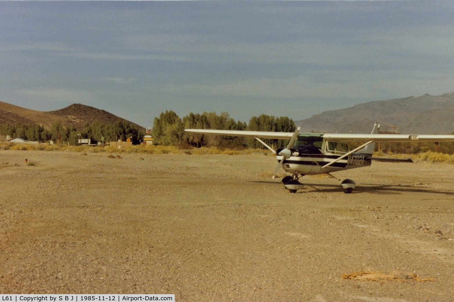 Shoshone Airport (L61) - 02x at Shoshone showing the short distance to town and the trees that you fly over on short final if landing on runway 15.Runway 33 is upslope with obstructions so a go around can be problematic.Was a fatal acc on a go around on 8-18-73.