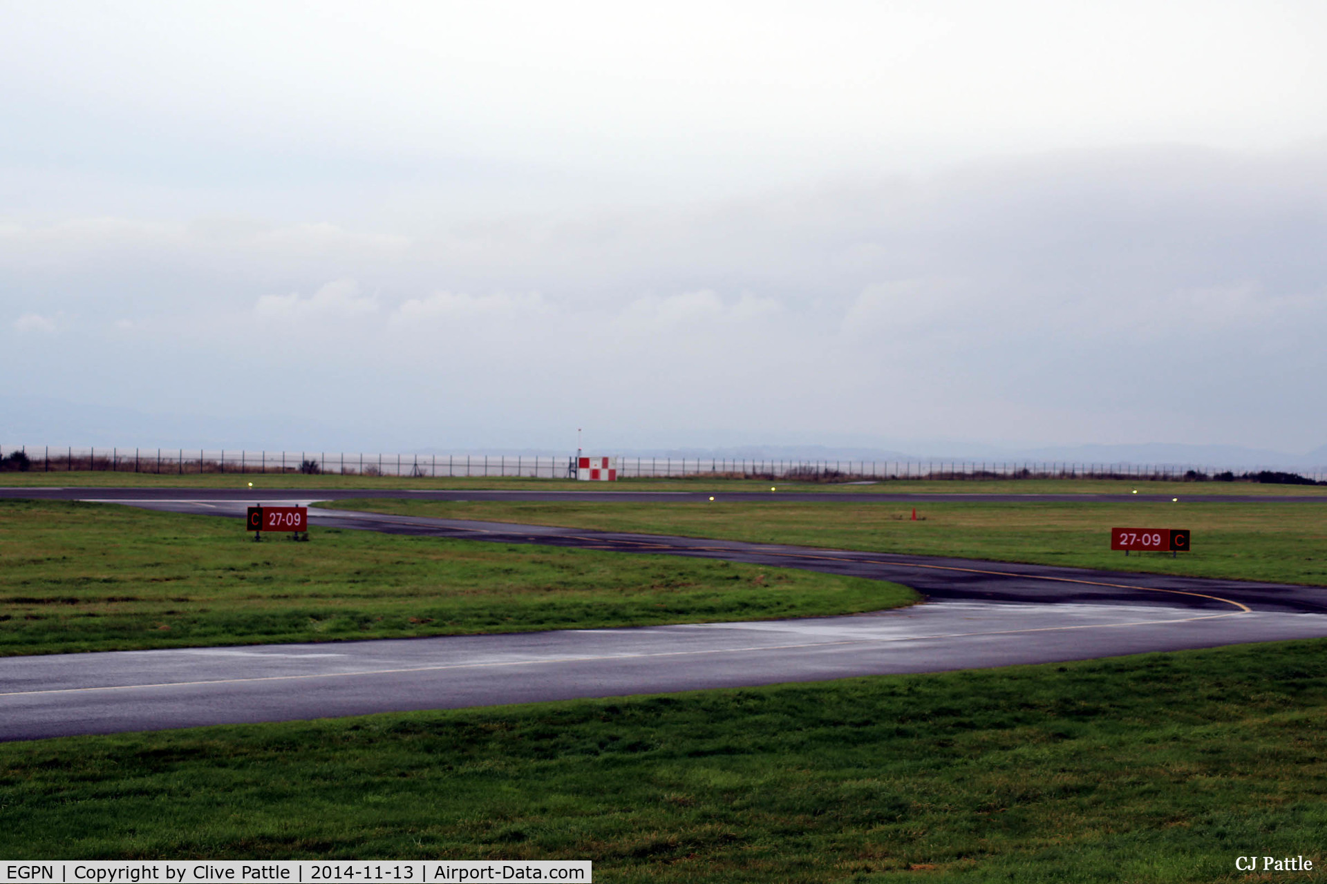 Dundee Airport, Dundee, Scotland United Kingdom (EGPN) - Threshold of taxiway and runway 09-27 at Dundee
