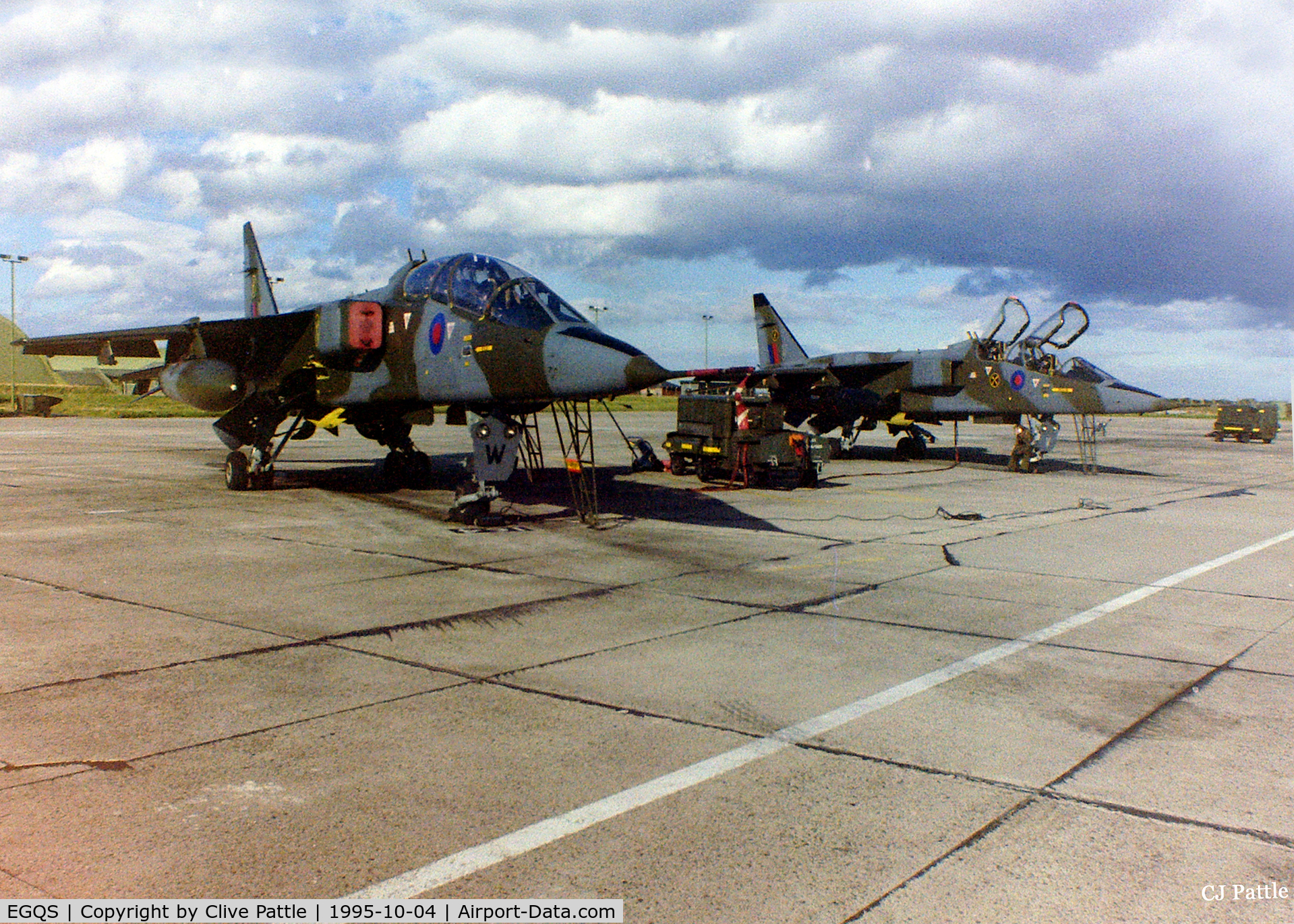 RAF Lossiemouth Airport, Lossiemouth, Scotland United Kingdom (EGQS) - 16 (R) Sqn ramp at RAF Lossiemouth EGQS in October 1995 showing two of the Sqn's Sepecat Jaguar T.2's awaiting their next training sortie.