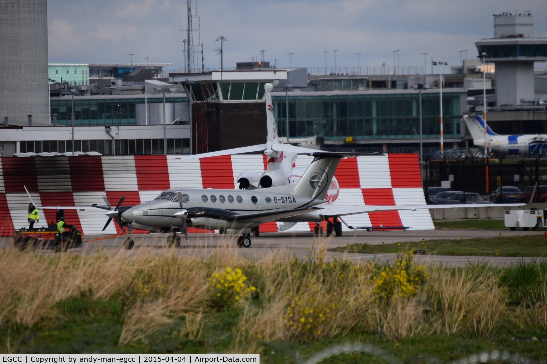 Manchester Airport, Manchester, England United Kingdom (EGCC) - parked on the landmark exc ramp

G-SYGA PH-AJX

photo taken from the AVP