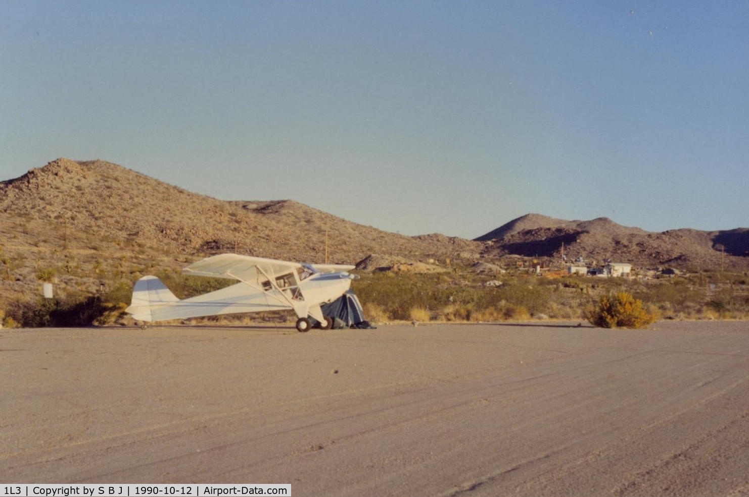 Searchlight Airport (1L3) - N39932 spending the night at Searchlight,Nevada airport).Was not much there in 1990. Lots of opportunity for expansion!! There was some road work for homes and hangars,but nothing more. Northerly view.