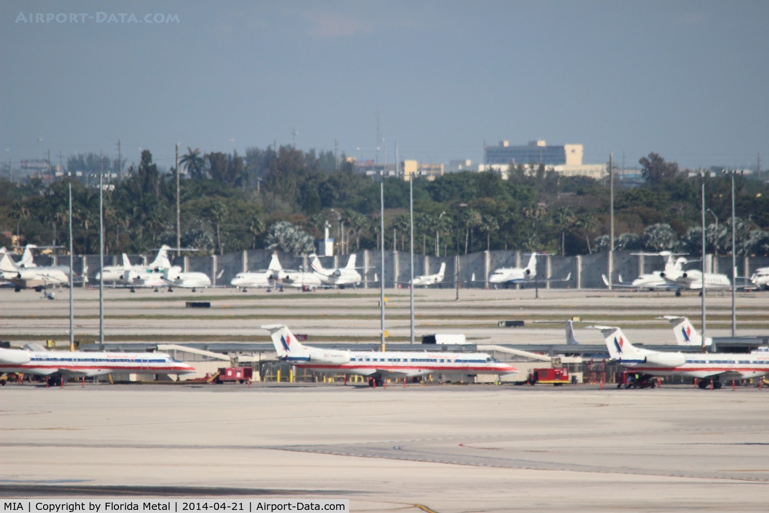 Miami International Airport (MIA) - American Eagle line up with biz jets in background