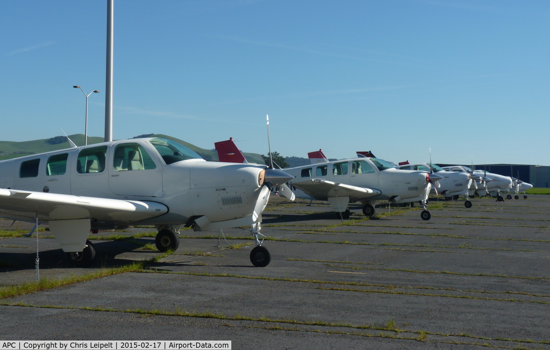 Napa County Airport (APC) - A long row of Beechcraft Bonanza 36's, each of them painted in the JAL livery.