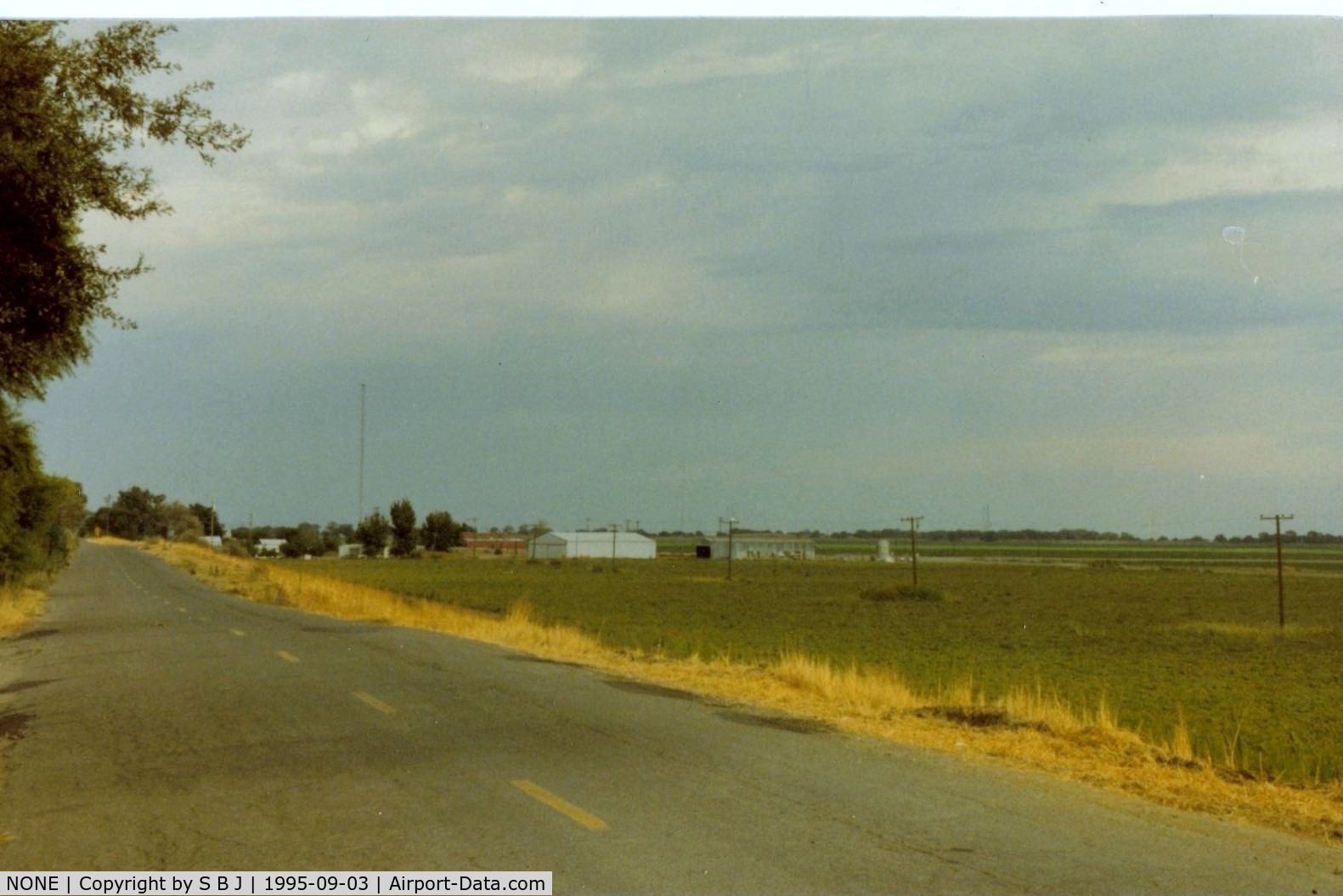 NONE Airport - Haley Ag strip north of Tracy,Ca.near the Sacramento delta.Was able to use it when I kept a boat at a near by marina.Runway is parallel to levee road.Large tower is wires crossing river.My C150 can almost be seen. View is east.