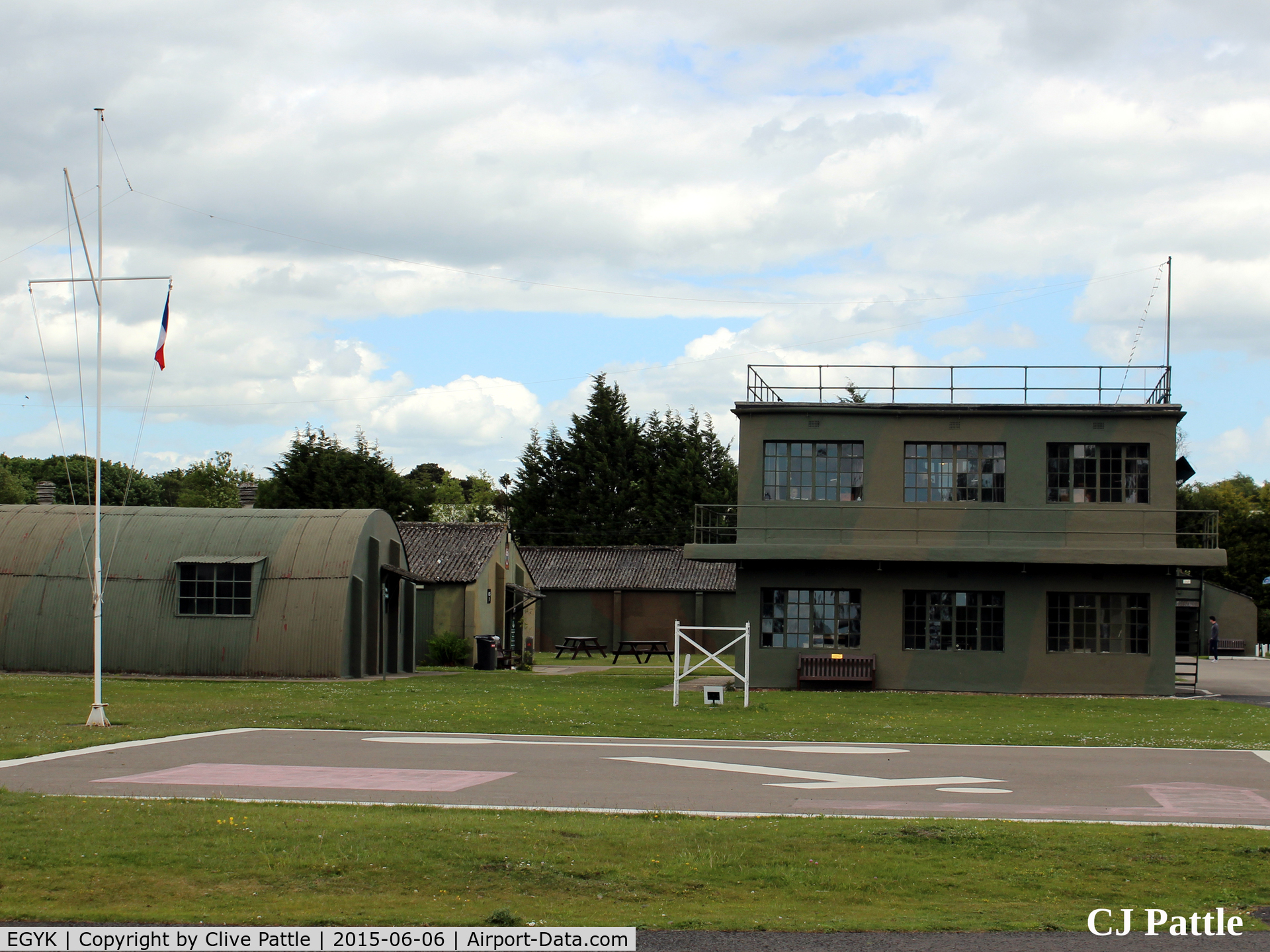 EGYK Airport - A view of the watchtower and nissen hut buildings at the Yorkshire Aviation Museum, Elvington. The Tricolor flies at the mast head as a memorial to the members of the French Sqns based at the airfield in WWII