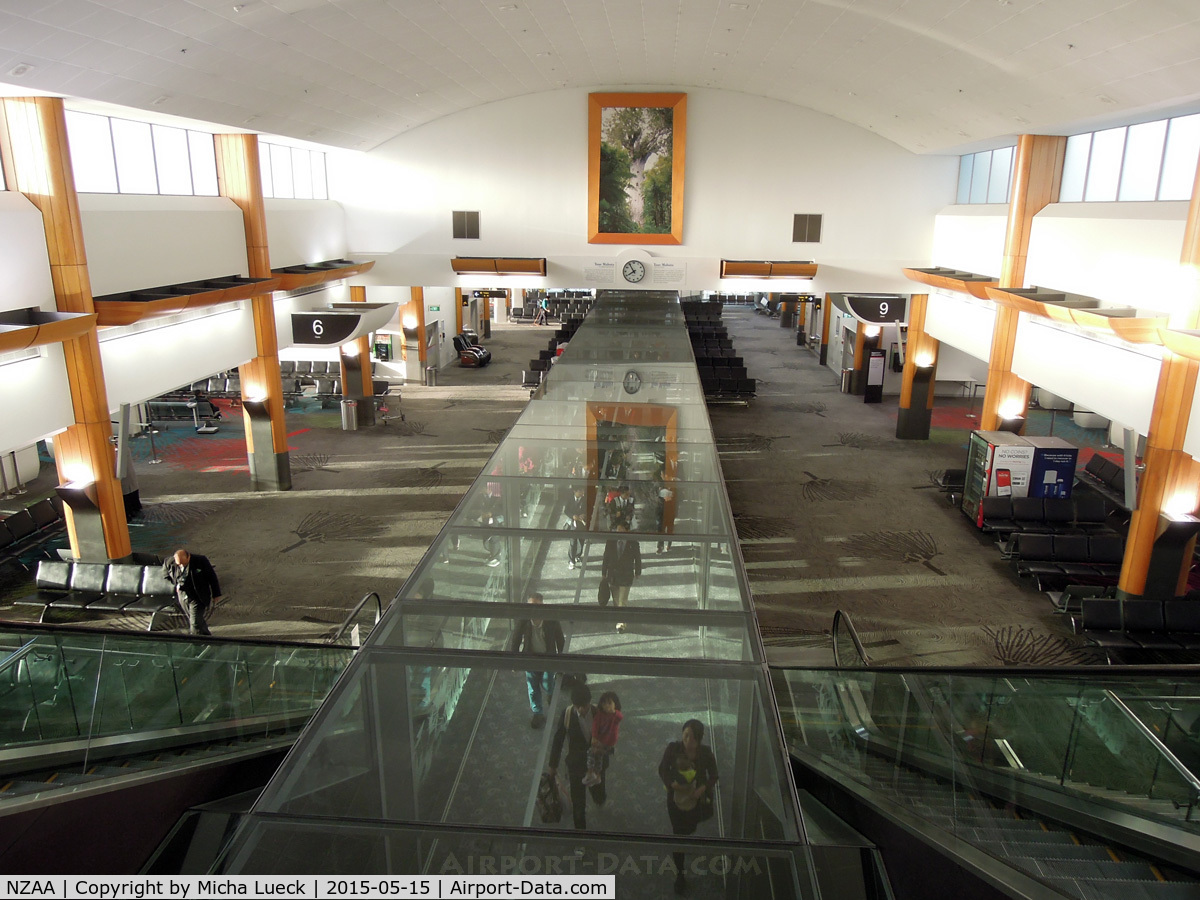 Auckland International Airport, Auckland New Zealand (NZAA) - Incoming passengers walking through a glass tunnel