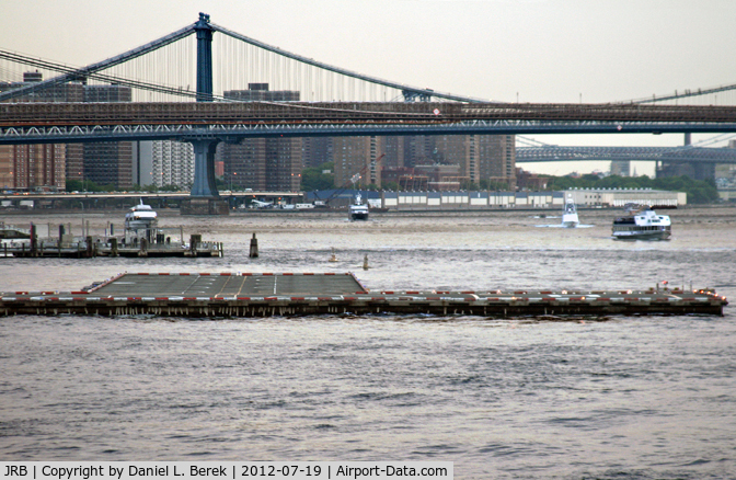 Downtown Manhattan/wall St Heliport (JRB) - This view is from just off the southern tip of Manhattan Island, with a nice East River cityscape for a backdrop.