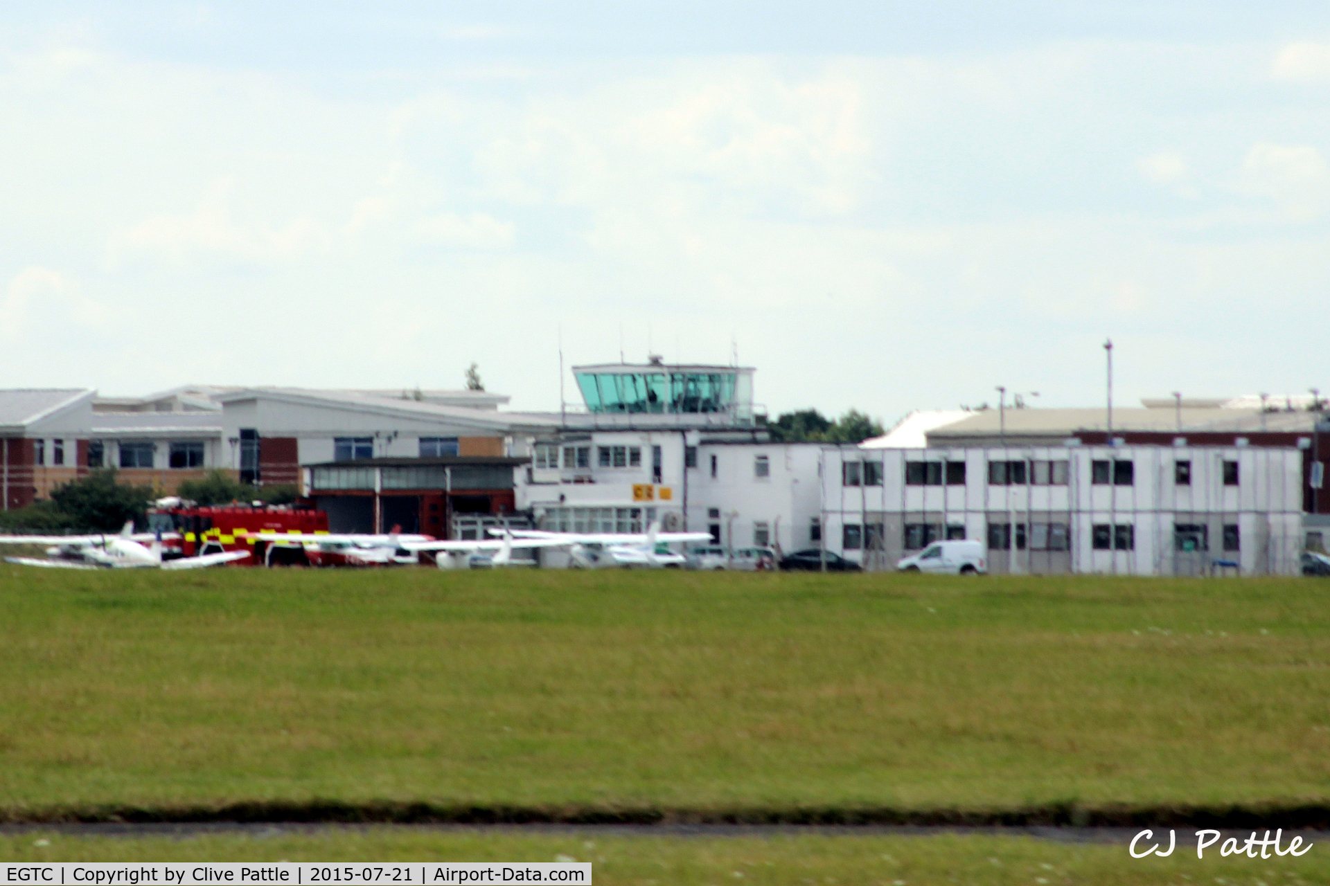 Cranfield Airport, Cranfield, England United Kingdom (EGTC) - The tower and other airport buildings at Cranfield EGTC, Bedfordshire, UK viewed from the runway