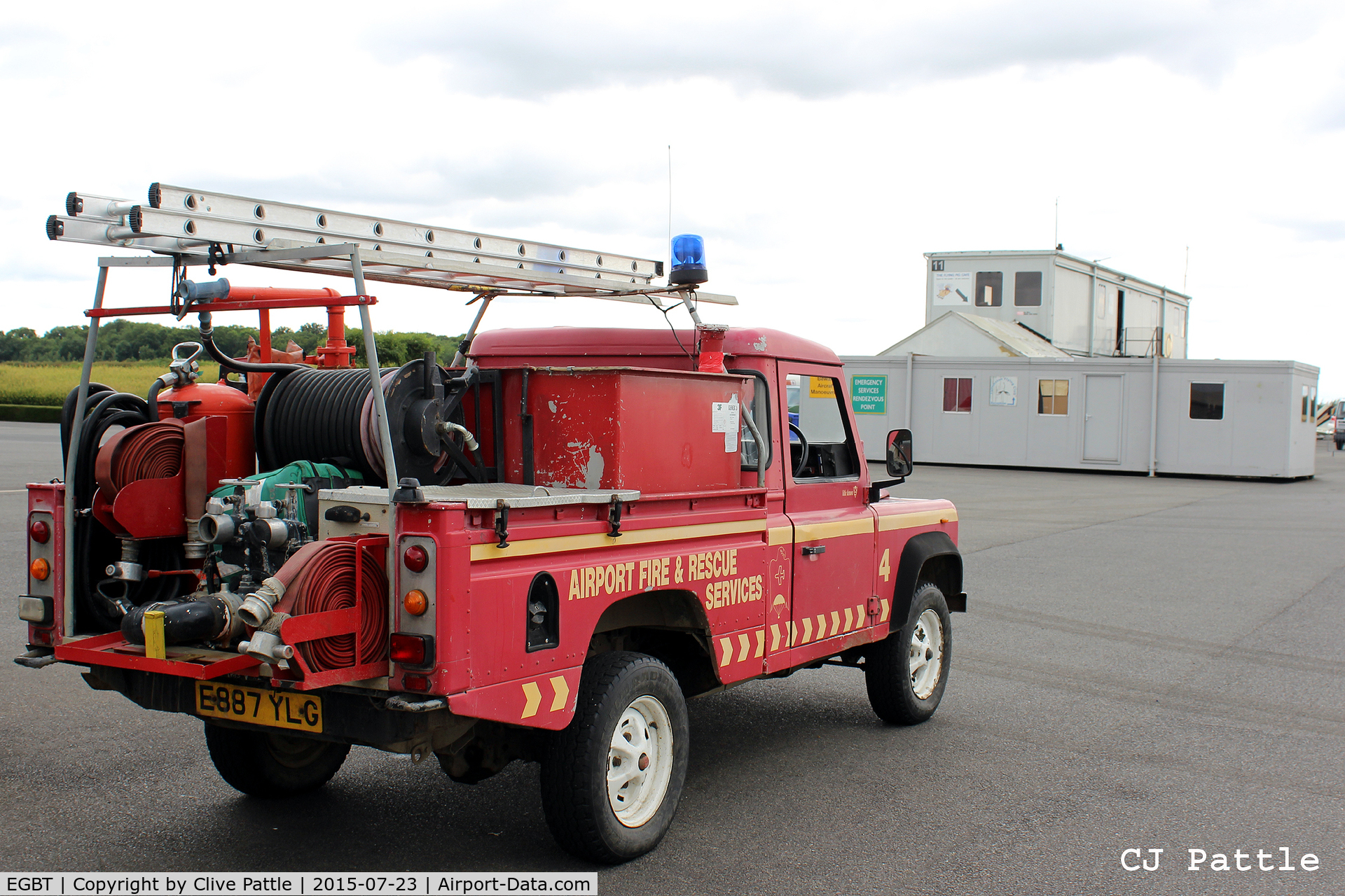 Turweston Aerodrome Airport, Turweston, England United Kingdom (EGBT) - The Fire Rescue Landrover at Turweston airfield with the temporary 'portacabin' ATC and Cafe accommodation in the background.