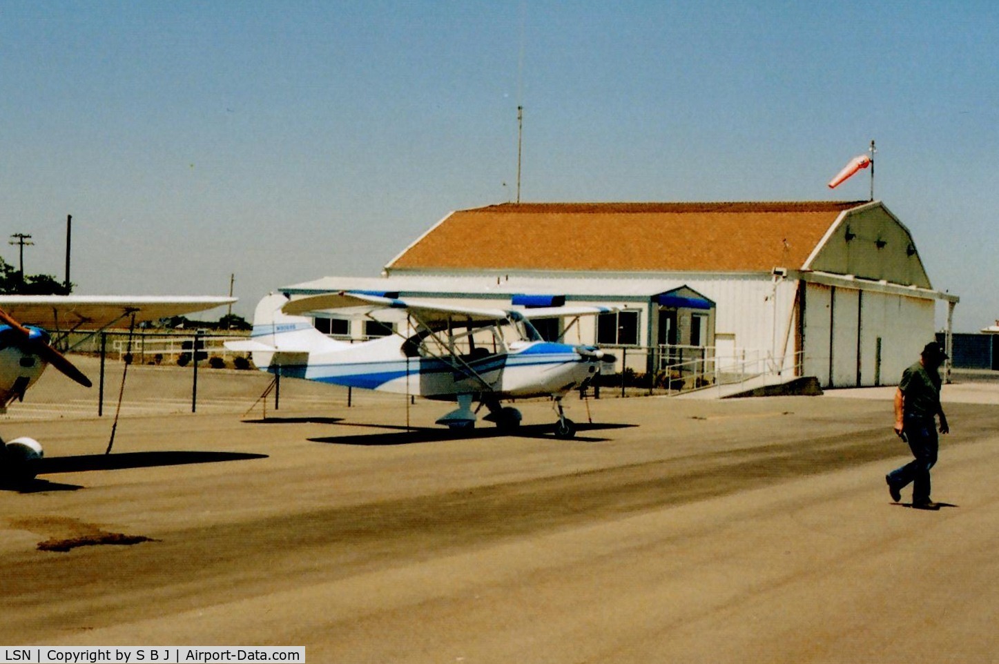 Los Banos Municipal Airport (LSN) - Good picture of the airport office and large hangar next to it.