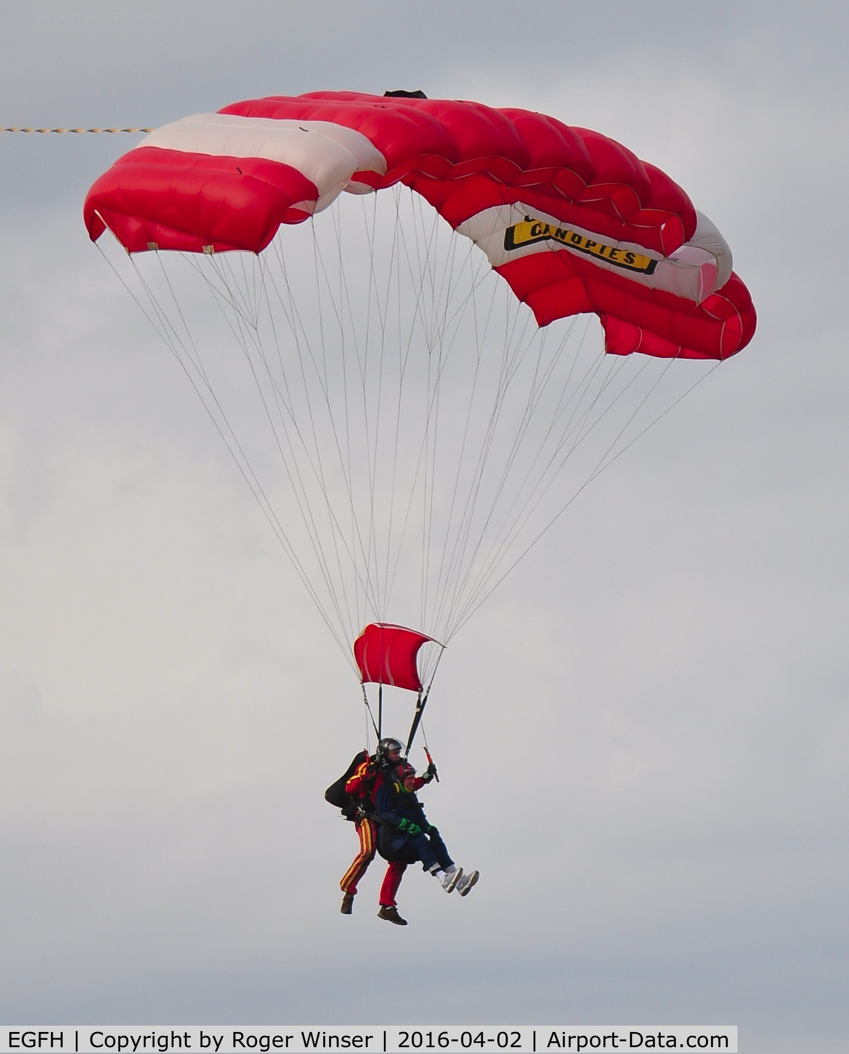 Swansea Airport, Swansea, Wales United Kingdom (EGFH) - Tandem skydivers from Skydive Swansea dropping in from 12000 feet