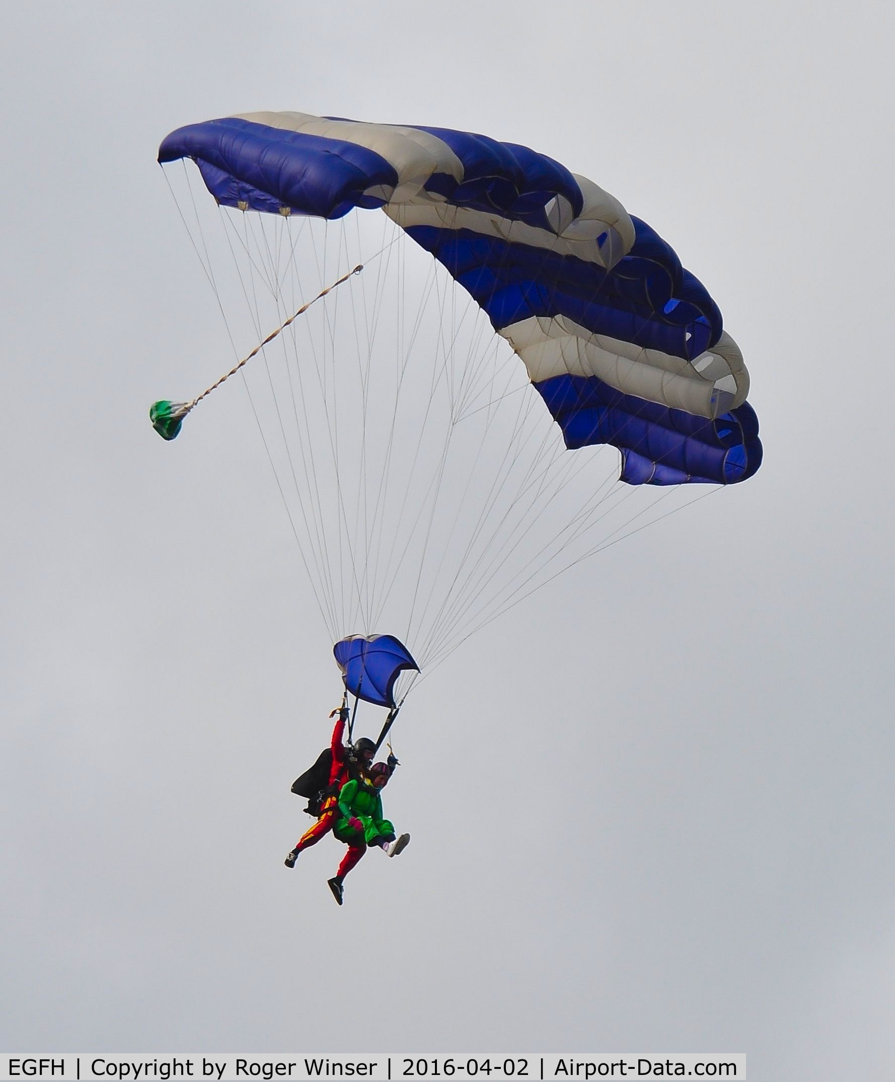 Swansea Airport, Swansea, Wales United Kingdom (EGFH) - Tandem skydivers from Skydive Swansea dropping in from 12000 feet.