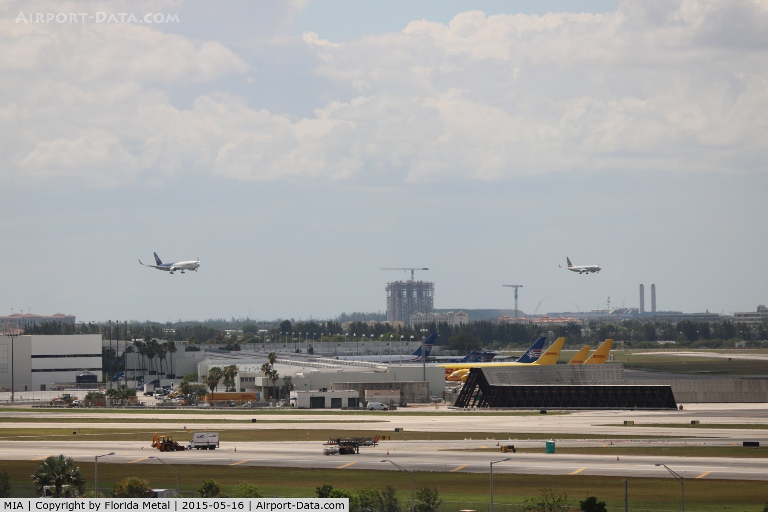 Miami International Airport (MIA) - Runway 9 being worked on while parallel landings occurring on 8L and R