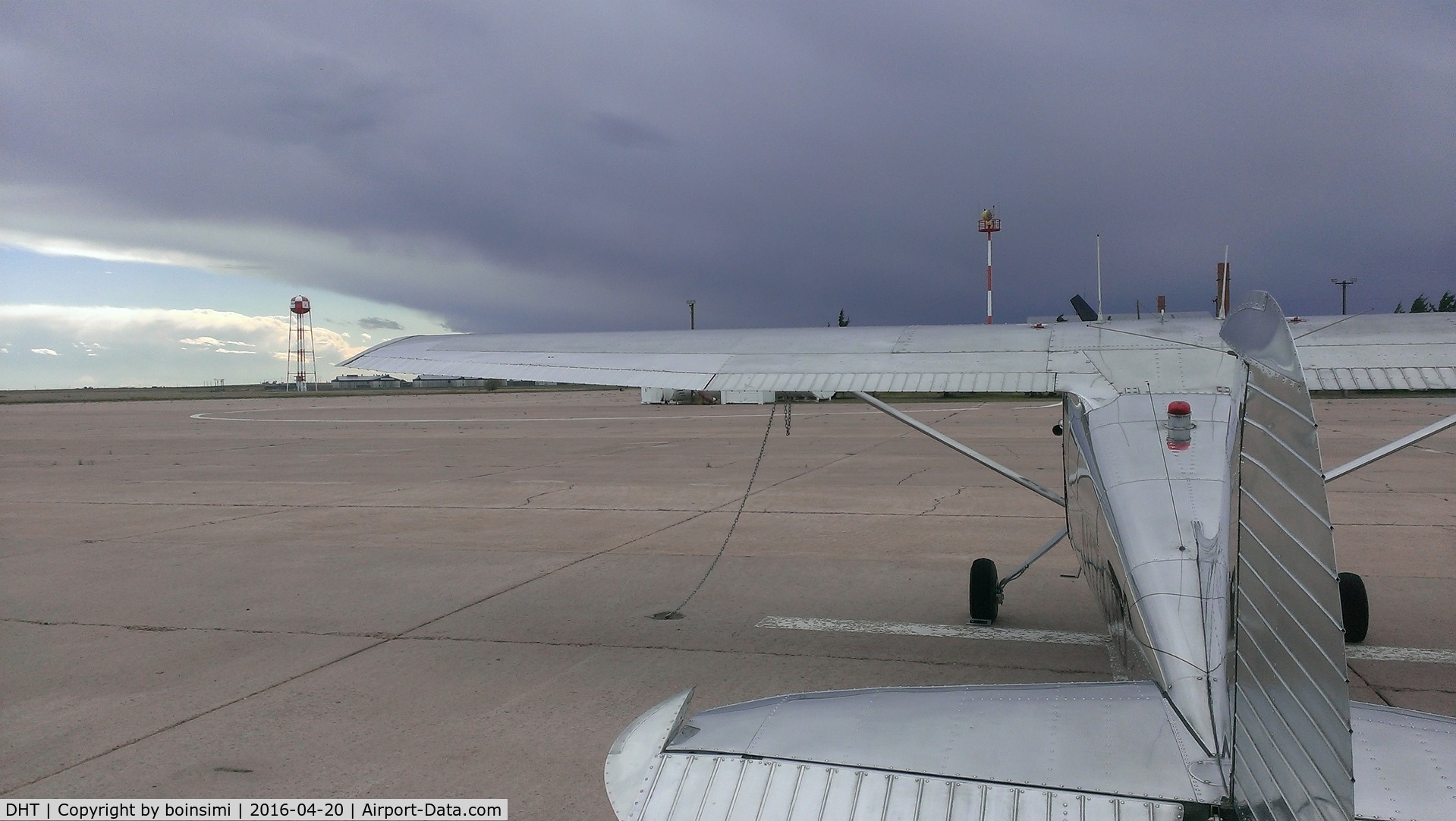 Dalhart Municipal Airport (DHT) - N1748D alone on the ramp at KDHT in Dalhart, TX as a monster thunderstorm bears down on us from the west.  Good Samaritan and head mechanic, Chuck, at Larsen Aviation helped me get it into a hangar 20 minutes after this shot before the storm hit.