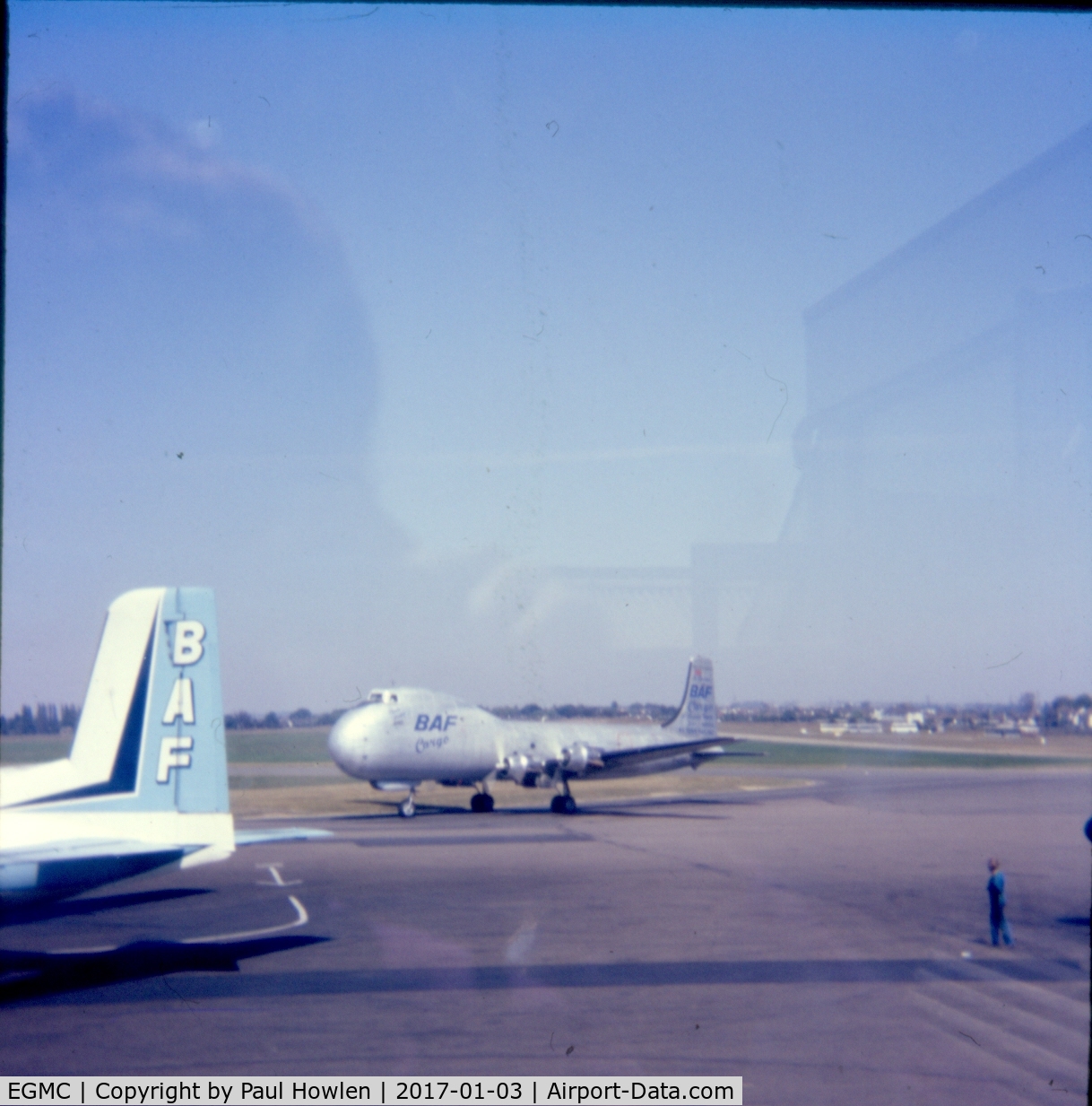 London Southend Airport, Southend-on-Sea, England United Kingdom (EGMC) - Southend Apron scene C.1976 with G-ASDC 'Plain Jane' and tail of Handley Page Herald 