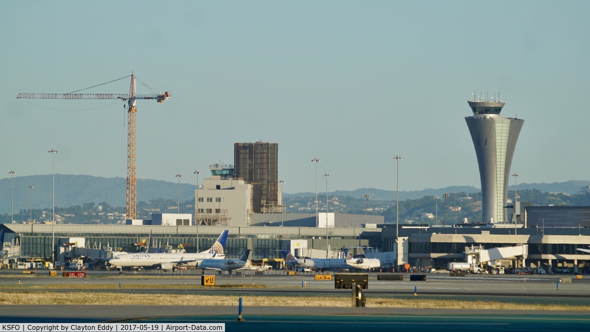 San Francisco International Airport (SFO) - Old towers being dismantled at San Francisco Airport. Tower on the left still has the old beacon.