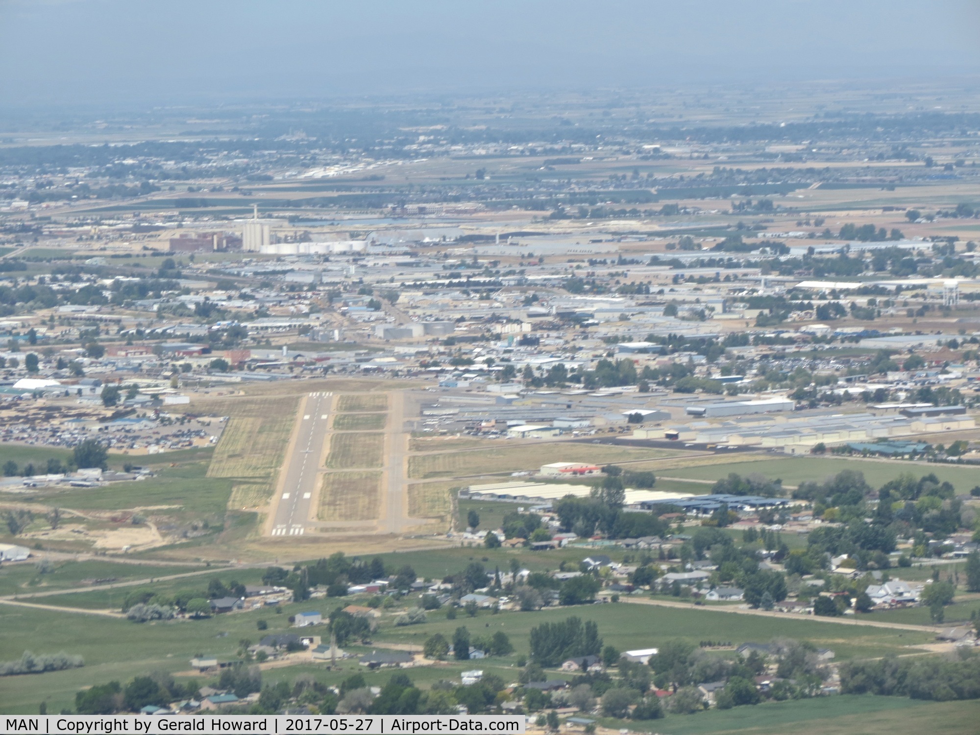 Nampa Municipal Airport (MAN) - East of the field turning downwind for RWY 11. Photo taken from N5017N, B-17G.