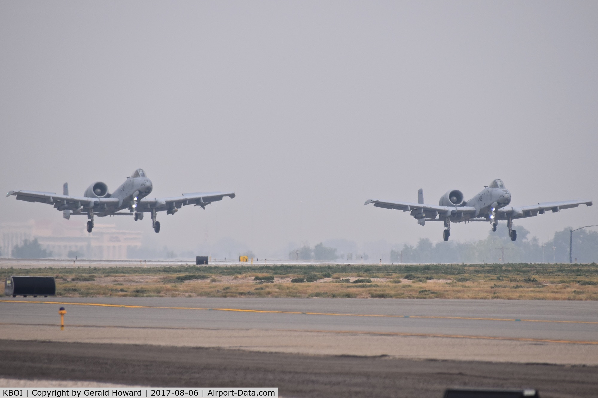 Boise Air Terminal/gowen Fld Airport (BOI) - Two A-10Cs from the 190th Fighter Sq., Idaho ANG making a formation landing on a 4 mile vis, smoky day.