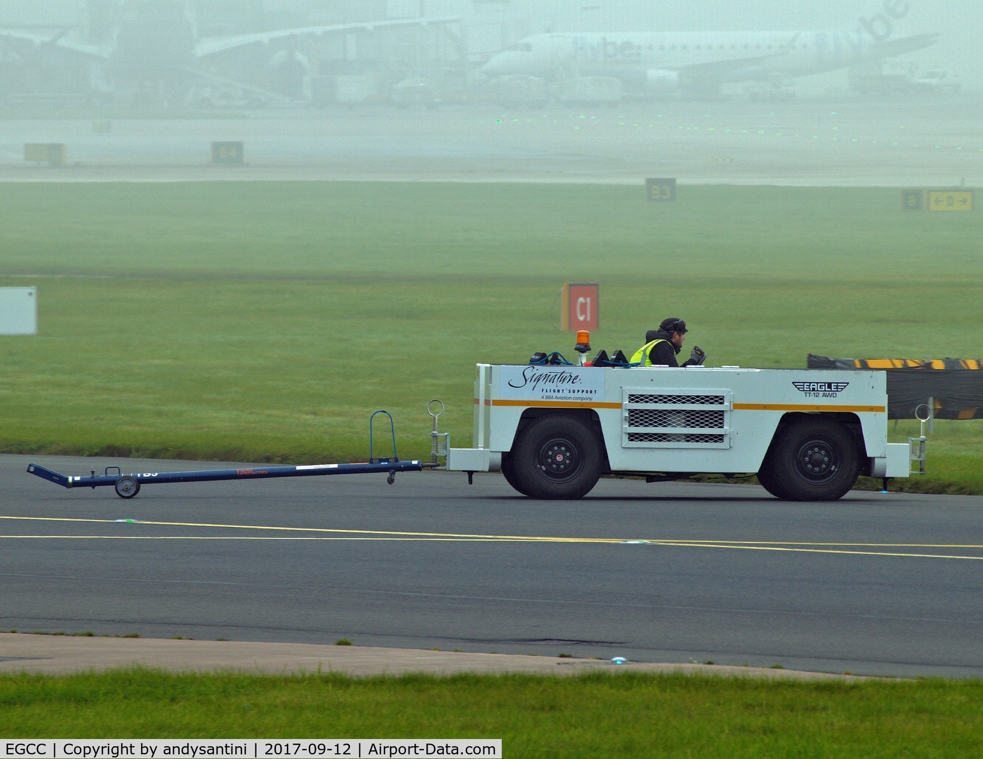 Manchester Airport, Manchester, England United Kingdom (EGCC) - FBO tug going to get [D-BUZZ CE750] and tow it over to the [FBO exc ramp] at egcc uk.