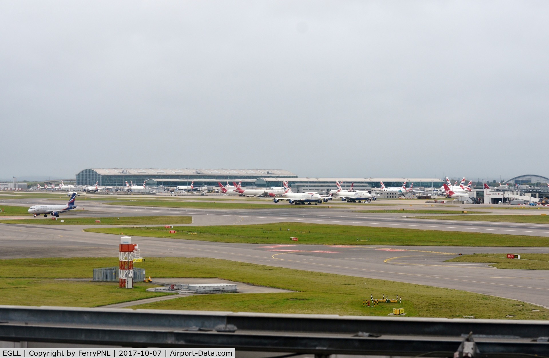 London Heathrow Airport, London, England United Kingdom (EGLL) - View toward Terminal 5 in the distance with part of T3 to the right.