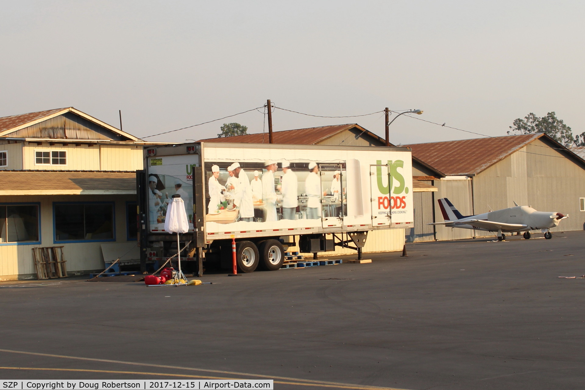 Santa Paula Airport (SZP) - Thomas Fire Airborne Firefighters need to be fed-this semi-trailer is the Food source. Smoky sky above and beyond.