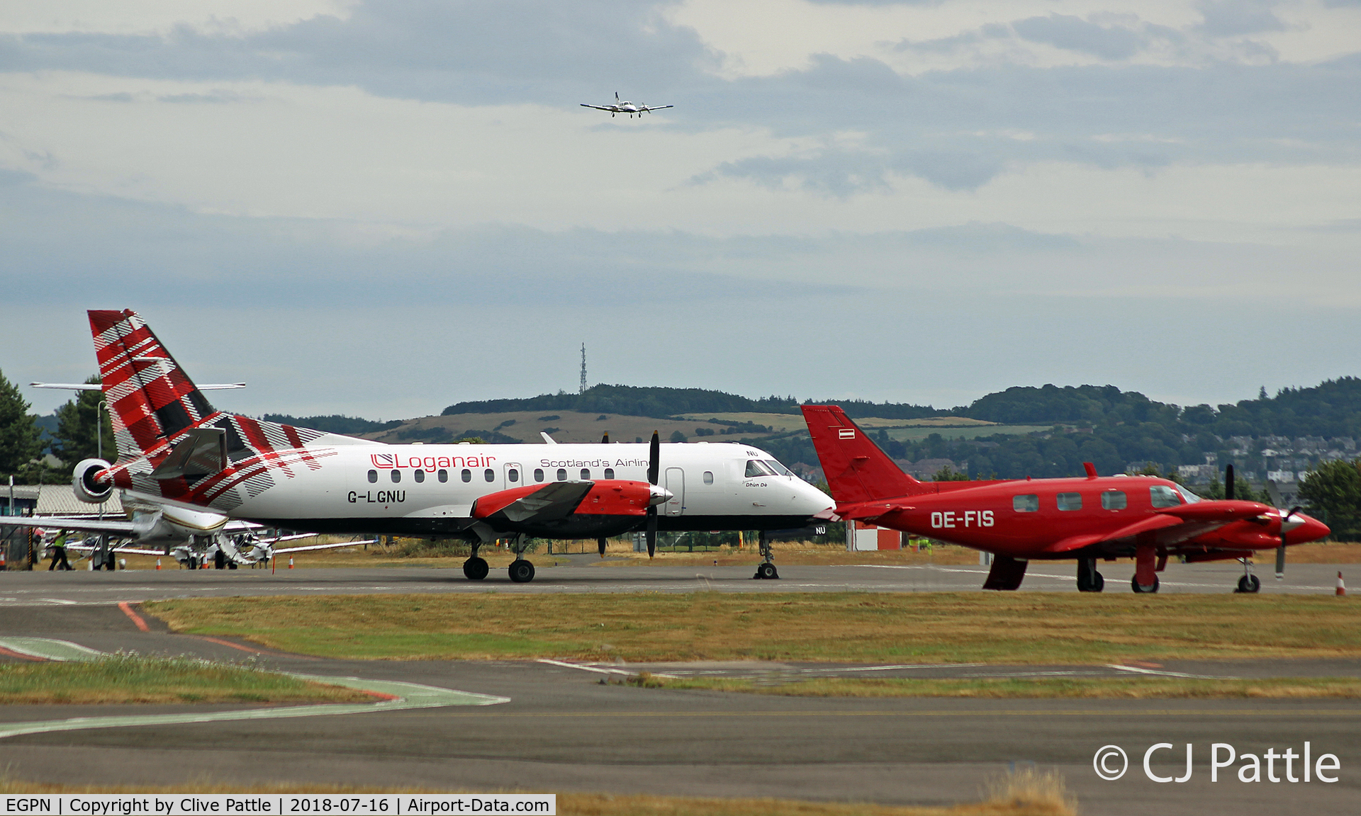 Dundee Airport, Dundee, Scotland United Kingdom (EGPN) - Dundee - Apron view. Loganair Saab 340 G-LGNU and visiting PA31 OE-FIS and Legacy G-HUBY share the space. In the distance based PA34 G-CAHA is on finals to land.