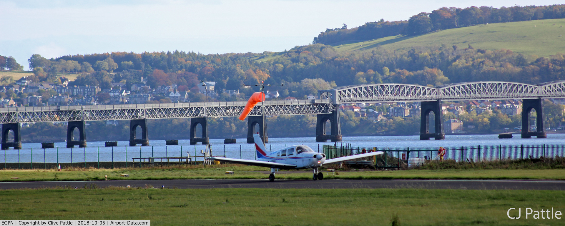 Dundee Airport, Dundee, Scotland United Kingdom (EGPN) - Facing south-east at Dundee with the Tay Rail Bridge in the background.