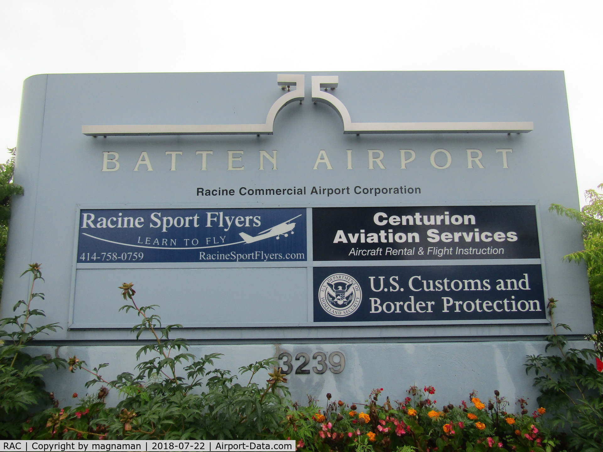 John H Batten Airport (RAC) - sign at entry to car aprk
