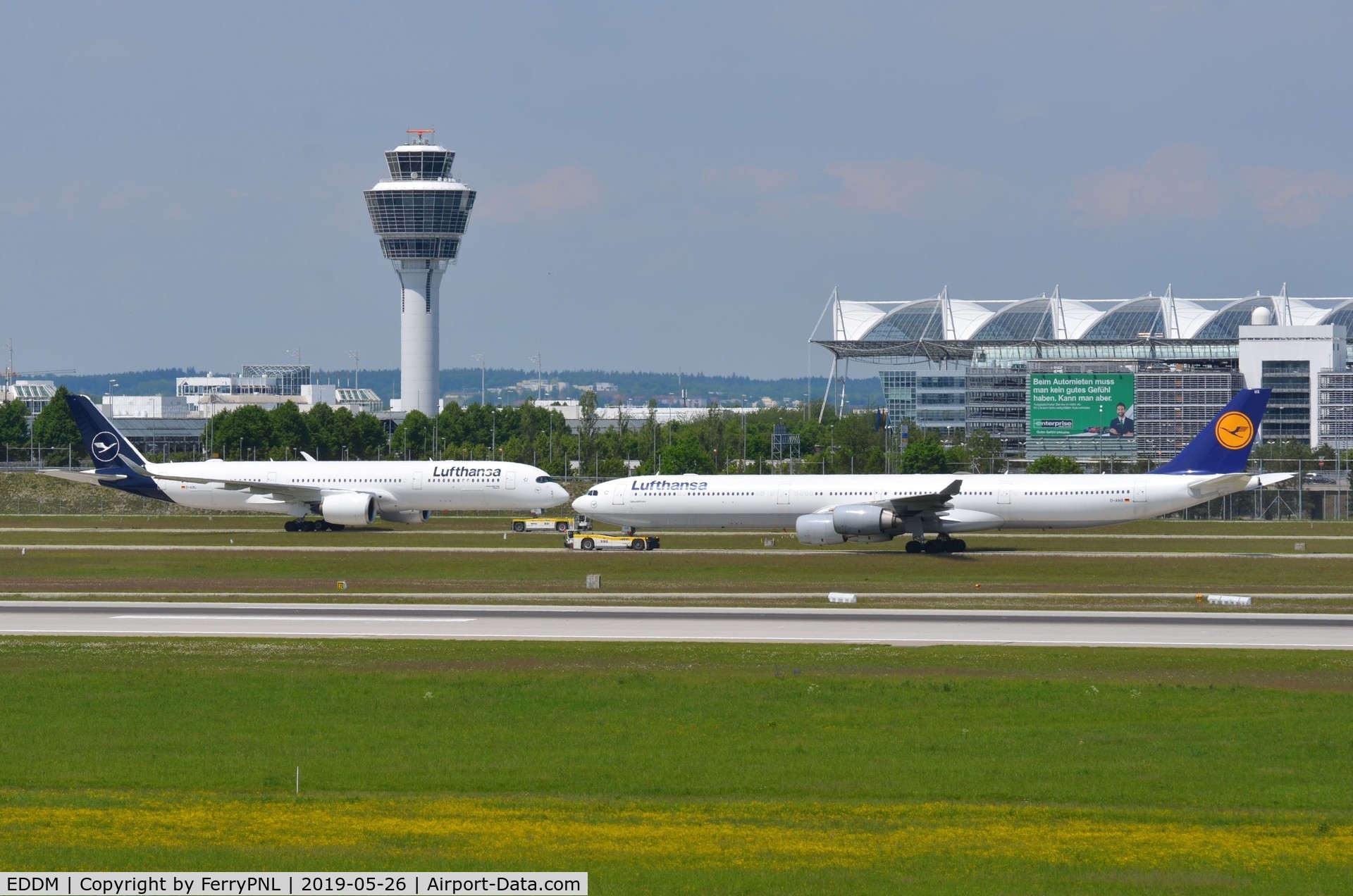 Munich International Airport (Franz Josef Strauß International Airport), Munich Germany (EDDM) - Munchen Airport, tower and part of the terminal and runway in front of the taxyways. View from spotting mount.