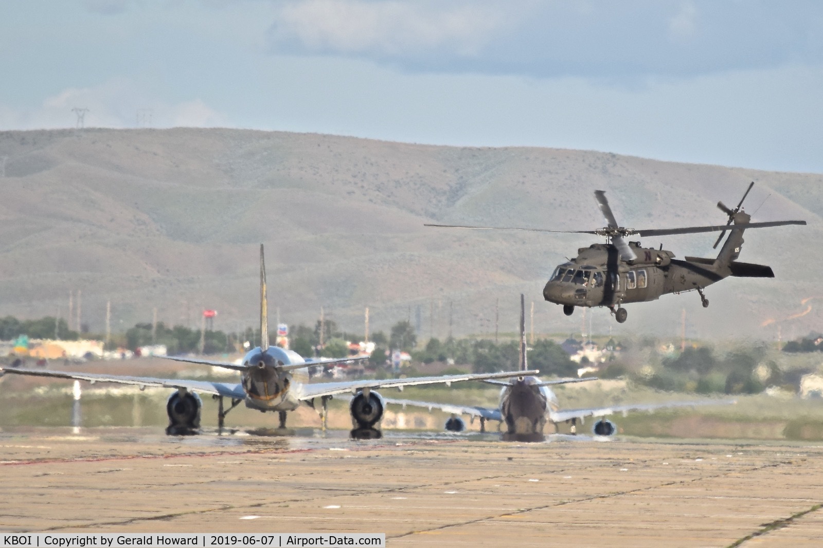 Boise Air Terminal/gowen Fld Airport (BOI) - UH-60A departs on Bravo after UPS & Fed Ex pass by headed for RWY 28L.