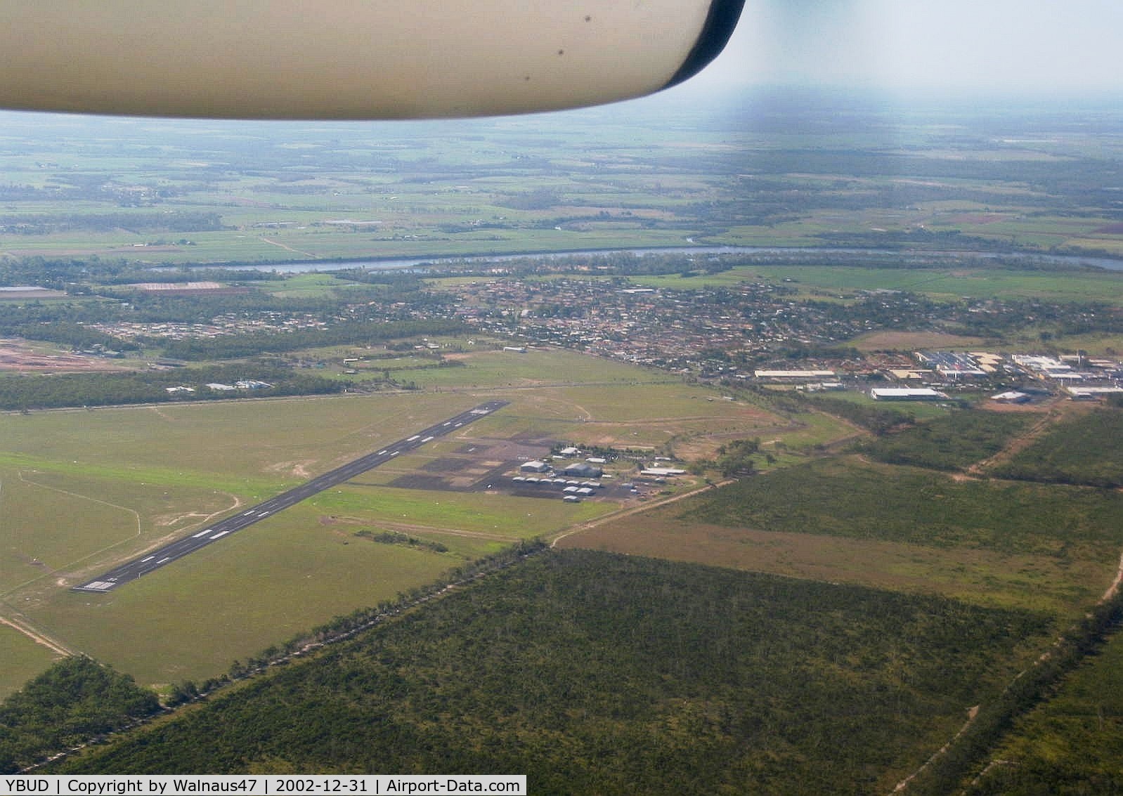 Bundaberg Airport, Bundaberg, Queensland Australia (YBUD) - Bundaberg Airport YBUD ‘Airport Overview’ as seen from Qantaslink DHC-8-102 Dash8 VH-TNW arriving from Brisbane YBBN on 31Dec2002. (‘Sugarland’ visible at right).