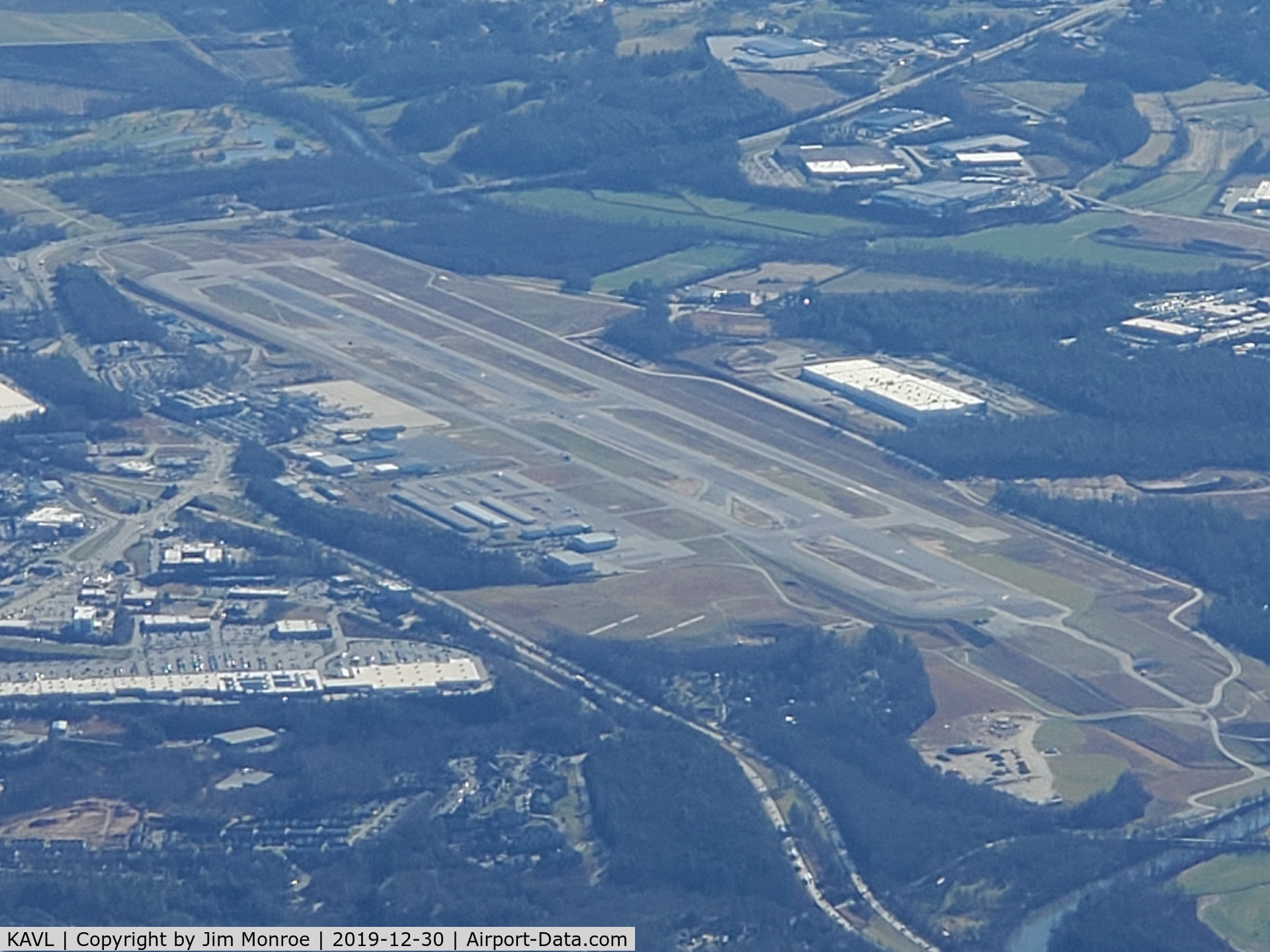 Asheville Regional Airport (AVL) - From 10,000 feet MSL looking south. The FAA determined that the runway was too close to the taxiway. They built a whole new runway (west side), tore up the old runway and built a new one (in the center). This has been in process several years.