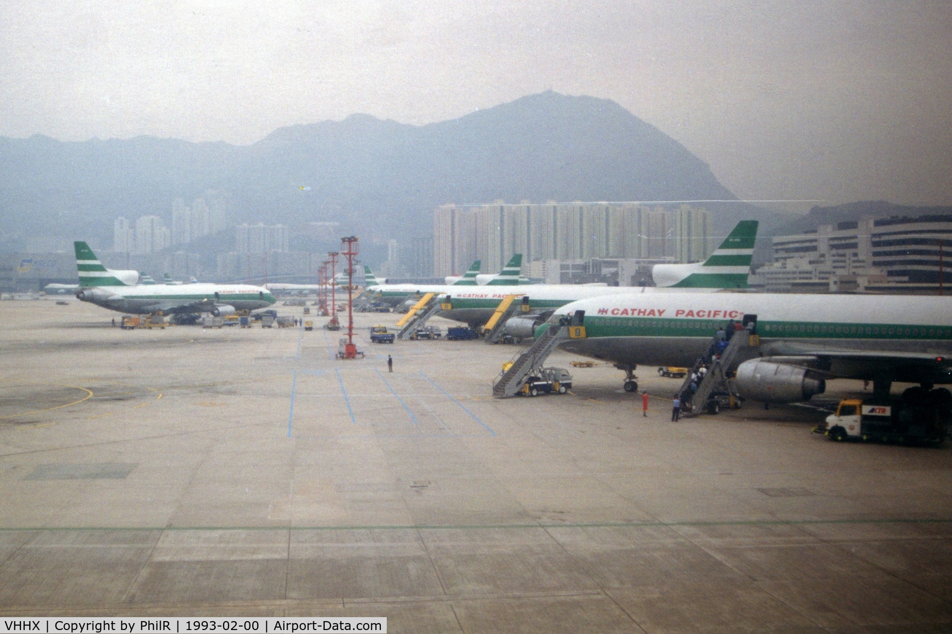 Kai Tak Airport (closed 1998), Kowloon Hong Kong (VHHX) - Scan of a poor photo of the Cathay ramp at Kai Tak HKG during a foggy morning landing in 1993.