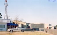 Suffolk Executive Airport (SFQ) - Back of the admin building, with one of the warbird hangers in the back - by Paul Perry