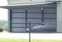Chesapeake Regional Airport (CPK) - Biz-Jet poking her nose out of the hangar a bit - by Paul Perry