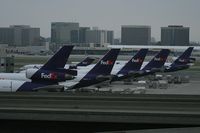 Los Angeles International Airport (LAX) - The FedEx terminal late in the evening at LAX is full. I count 7 aircraft just on this side. There are more to the right that are out of view. - by Dean Heald