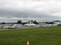 Frederick Municipal Airport (FDK) - This is the Frederick Flight Center ramp.  On any other day there would not be the white tents in front of the old tower, but this was AOPA Fly-in day. - by Sam Andrews