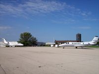 Poplar Grove Airport (C77) - Two business jets at Poplar Grove on the same day. - by Mark Pasqualino