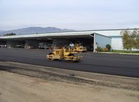 Santa Paula Airport (SZP) - Grading newly resurfaced asphalt aircraft ramp - by Doug Robertson