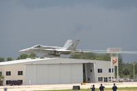 Daytona Beach International Airport (DAB) - Yelvington Hangar with an F-18 taking off in front of it - by Florida Metal